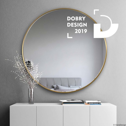 Złote okrągłe lustro Scandi Slim nad białą komodą. GieraDesign