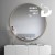 Złote okrągłe lustro Scandi Slim nad białą komodą. GieraDesign