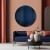 Lustro Neptune z kolekcji Cosmic w salonie nad kanapą. Studio Szpunar dla GieraDesign