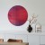 Lustro ozdobne Mars z kolekcji Cosmic nad komodą. Projekt Szpunar Studio dla GieraDesign. Średnica lustra fi 50 cm.