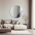 Okrągłe dekoracyjne lustro Sunset antique w nowoczesnym salonie. GieraDesign