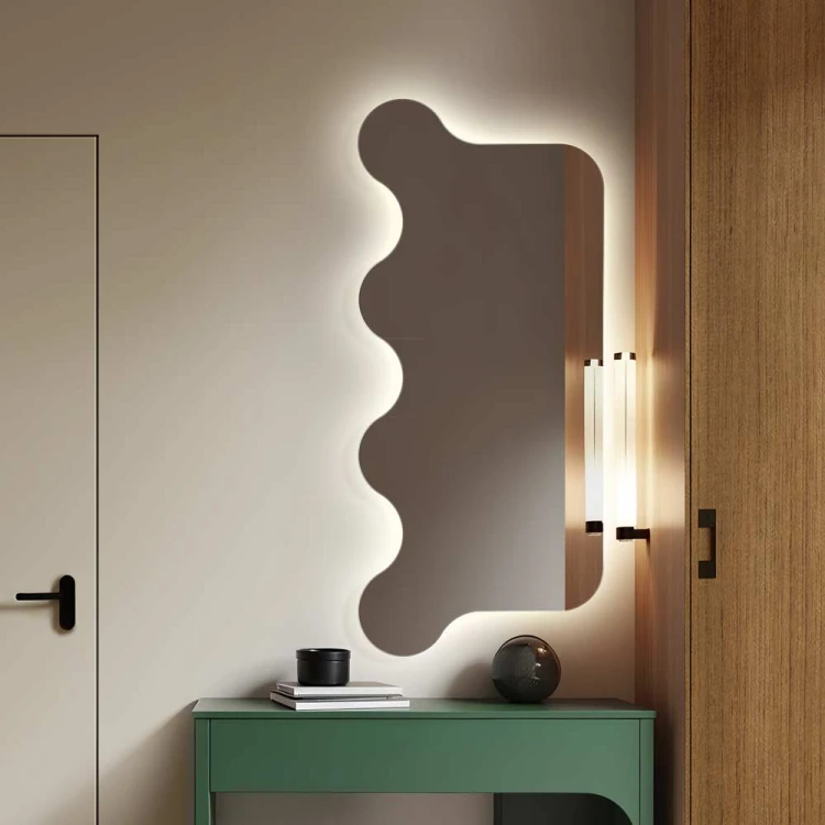 Lustro z falą podświetlane "Falala" nad zieloną nowoczesną komodą. GieraDesign