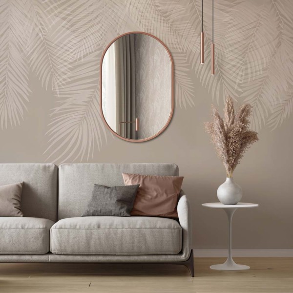 Lustro owalne Ambient w miedzianej ramie nad sofą w beżowym salonie. GieraDesign