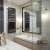 Lustro Attika Gold - w  czarno-złotej ramie glamour w beżowej łazience. GieraDesign