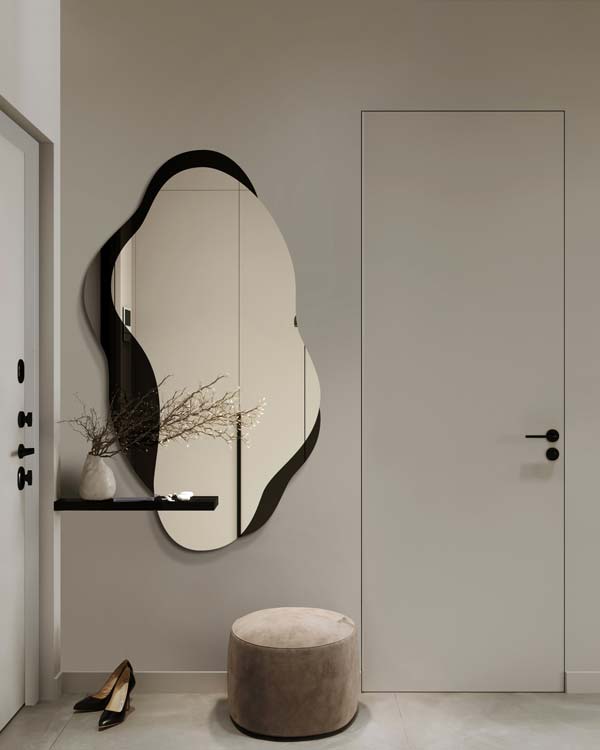 Dekoracyjne niregularrne lustro Libido w nowoczesnym przedpokoju