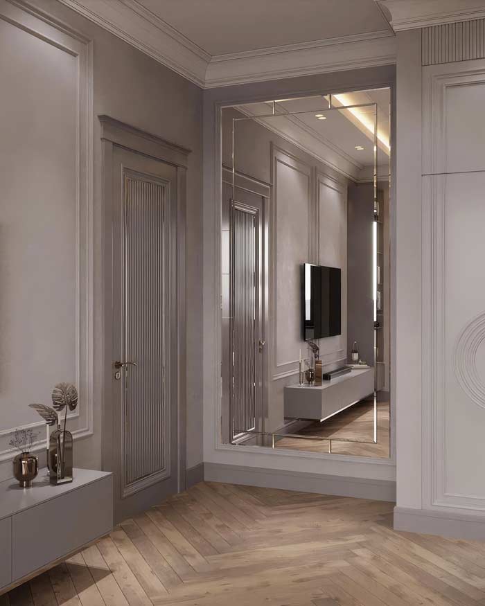 duże Lustro zawieszone we wnęce powiększa optycznie wnętrze salonu